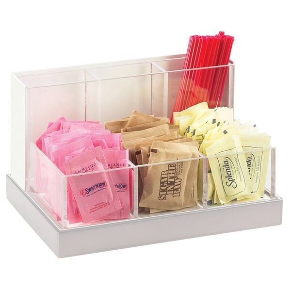 A Cal-Mil stainless steel multi-bin organizer with condiments and straws.