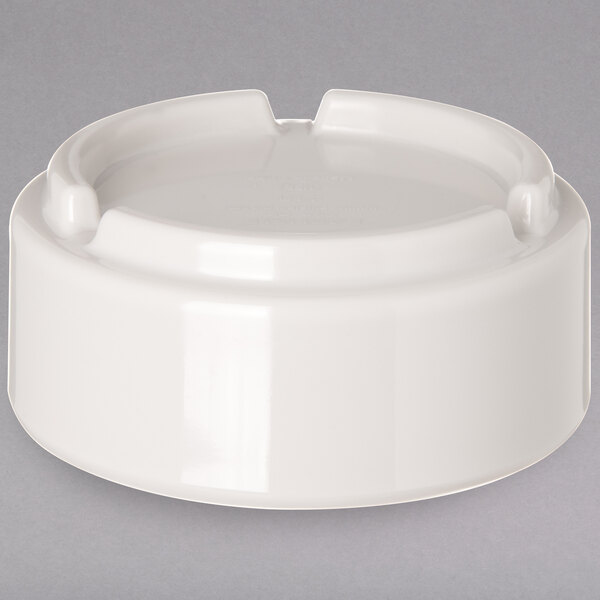 A Carlisle ivory bone melamine ramekin with a white lid.