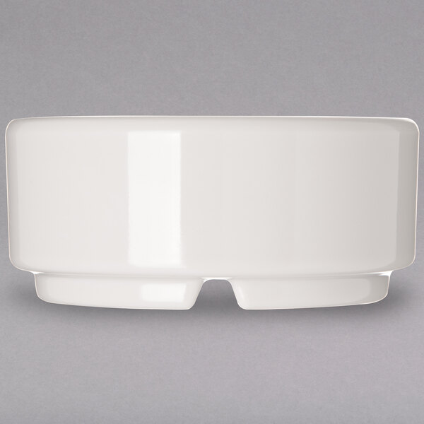 A Carlisle ivory bone melamine ramekin with two handles.