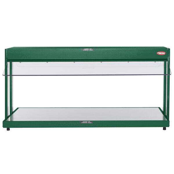 A green Hatco countertop buffet warmer with glass shelves.