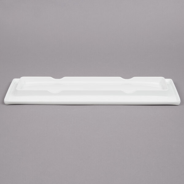 A white rectangular Tablecraft melamine tray with a black border.
