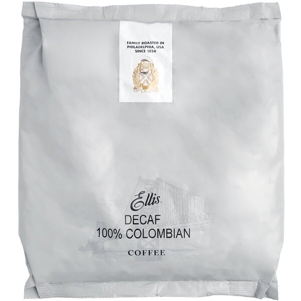 A white package of Ellis 100% Colombian Decaf Whole Bean Coffee with a label.