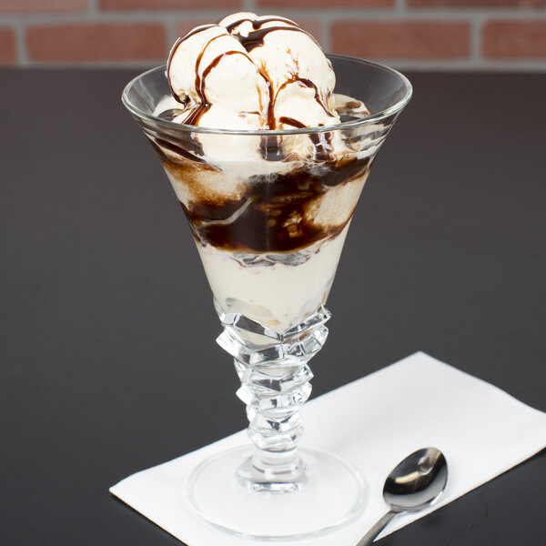 A scoop of chocolate ice cream in an Arc Cardinal Palmier dessert dish.