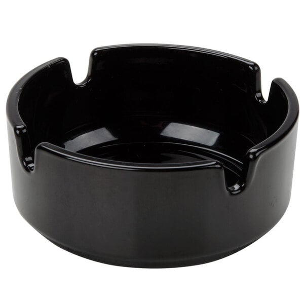A black Arcoroc round glass ashtray.