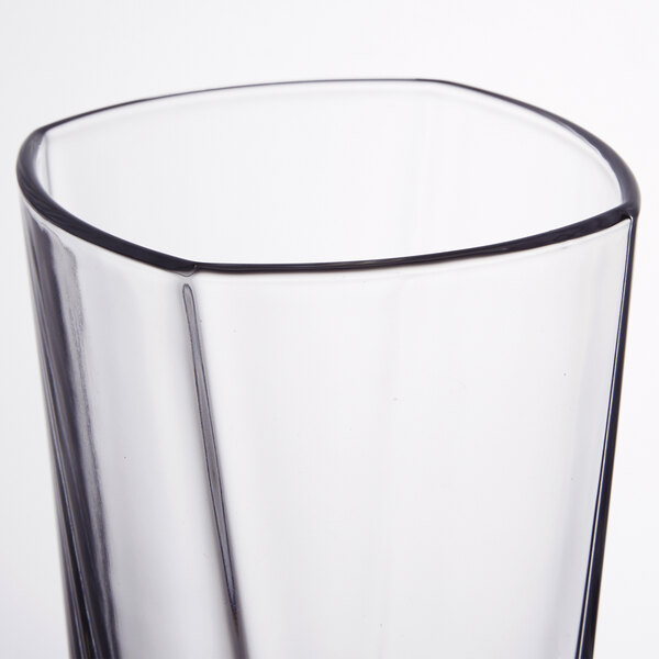 An Arcoroc cooler glass with a black rim.