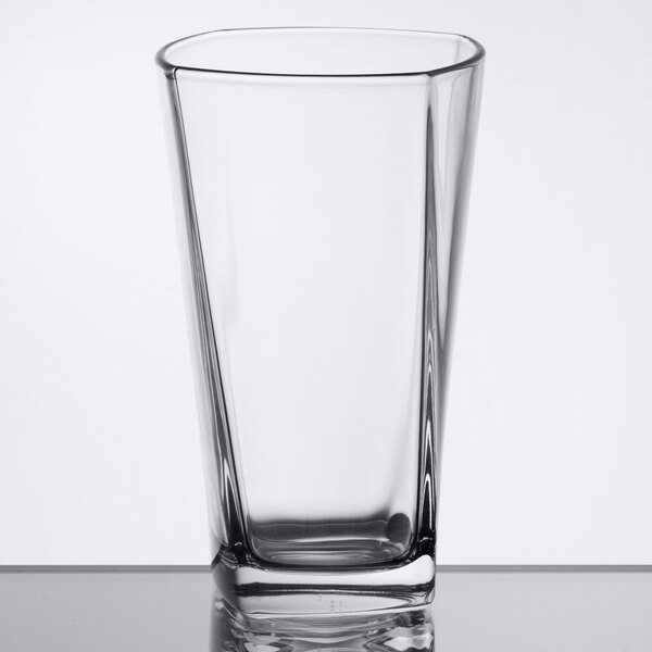 An Arcoroc clear glass tumbler on a table.