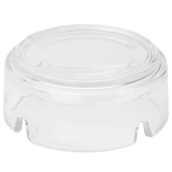 An Arcoroc round glass ashtray on a white background.