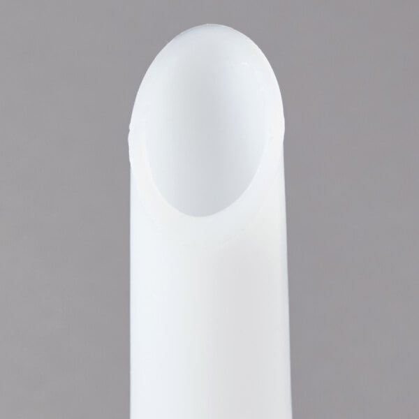 A white plastic sausage stuffer tube.