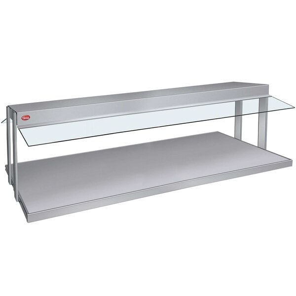 A stainless steel Hatco buffet warmer with glass shelves on a counter.