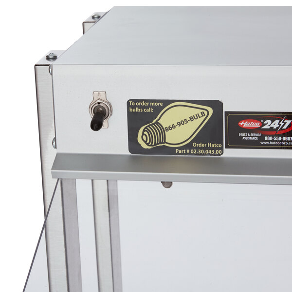 A white metal Hatco countertop buffet warmer with a light on it.