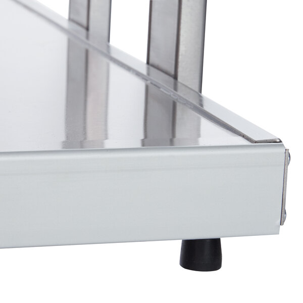 A metal shelf with a metal handle on a Hatco countertop buffet warmer.