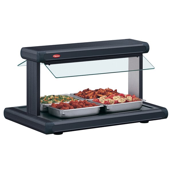 A black Hatco buffet warmer with food trays on a countertop.