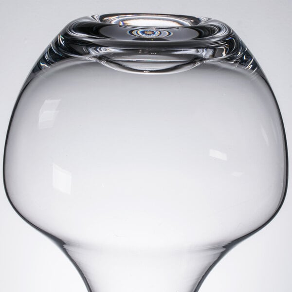A clear Chef & Sommelier glass decanter with a small hole in the bottom.