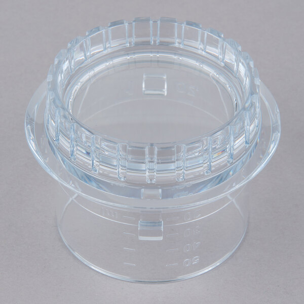 A clear plastic fill cap with a ring on top.