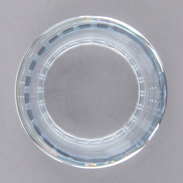 A clear glass circle with a circular design.