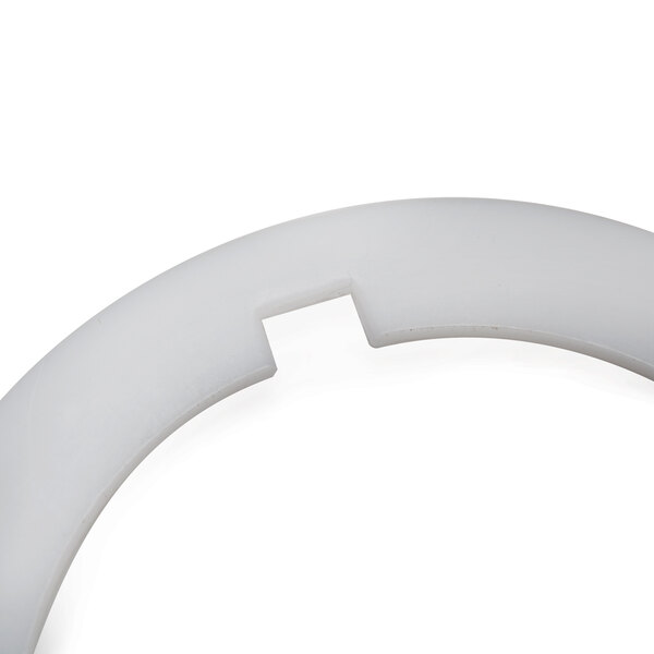 A white Waring blender plastic washer with a notch.