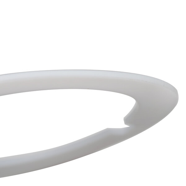 A white plastic circular blender washer with a notch.