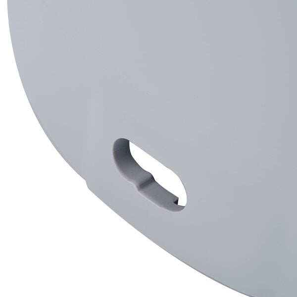 A close-up of a Robot Coupe continuous feed attachment with a white background.