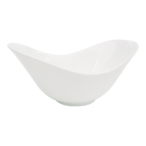 A CAC bone white porcelain spirit dish with a curved edge.