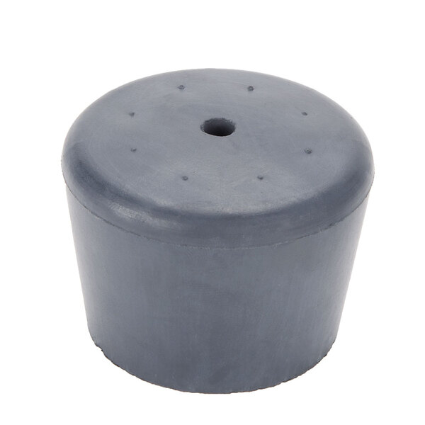 A gray rubber stopper with holes for a Waring stainless steel blender lid.