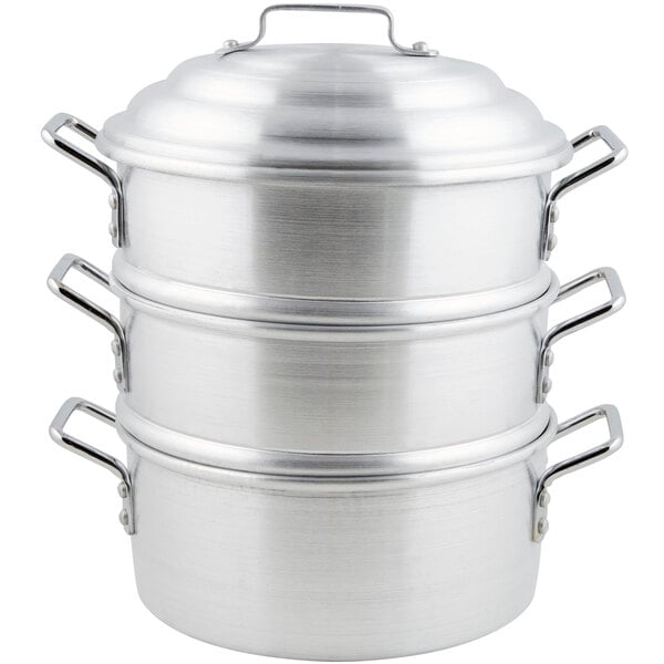 A stack of aluminum steamer pots.