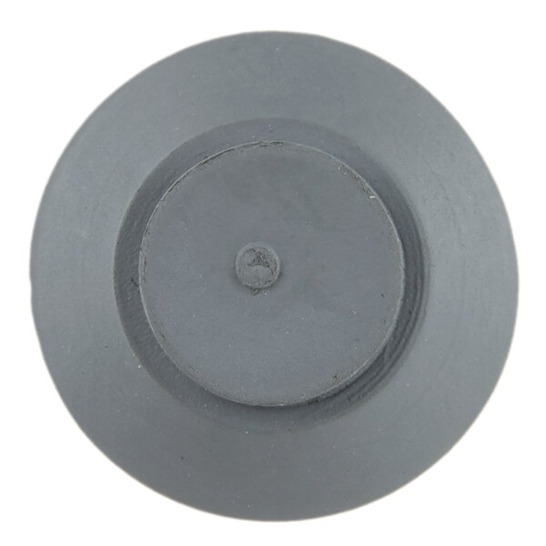 A close-up of a grey circle with a hole in it.