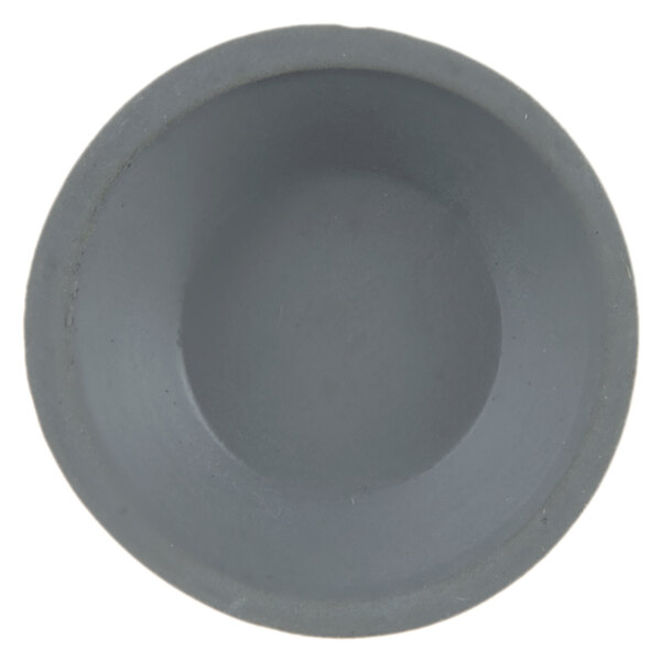 A grey suction cup foot for a blender.