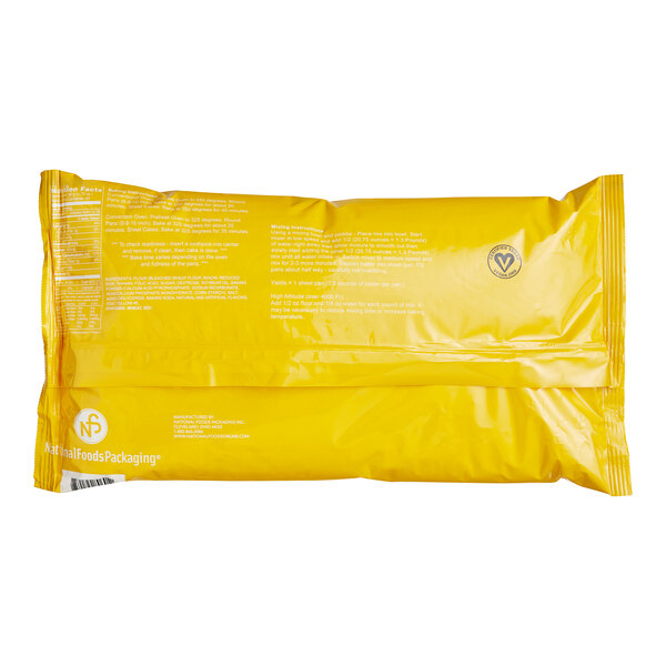 A yellow plastic bag of yellow cake mix with white text.