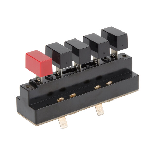 A black rectangular Waring push button switch with a red square on top.