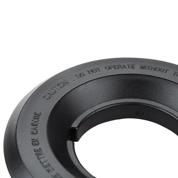 A black circular rubber lid with the words "Waring 013442 4 1/2" Outer Lid" in white text.