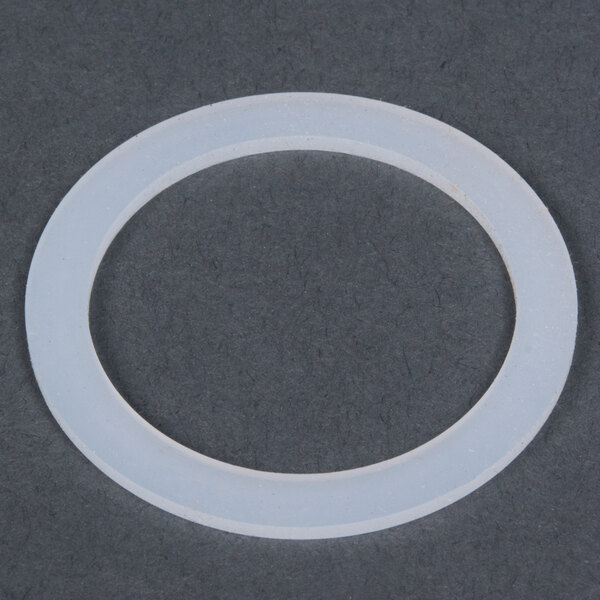 A white plastic gasket with a white circle.