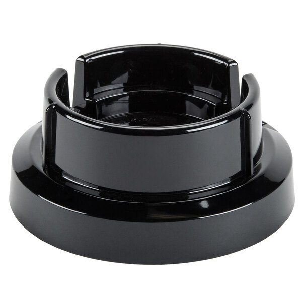 A black plastic Waring blender jar adapter.