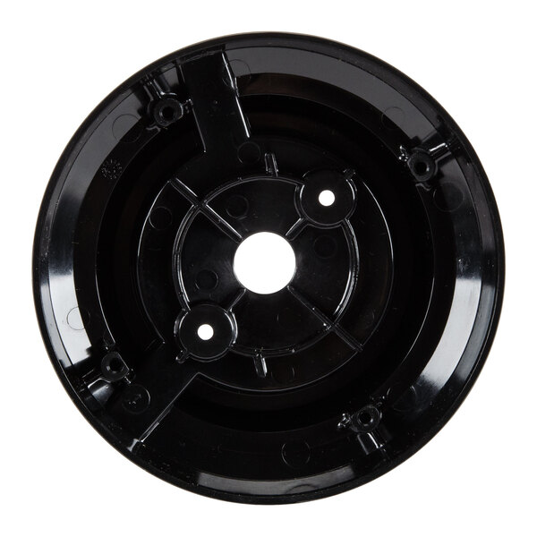 A black circular plastic disc with holes.