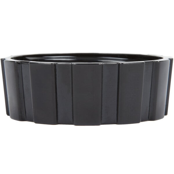 A black rectangular container with a curved edge.