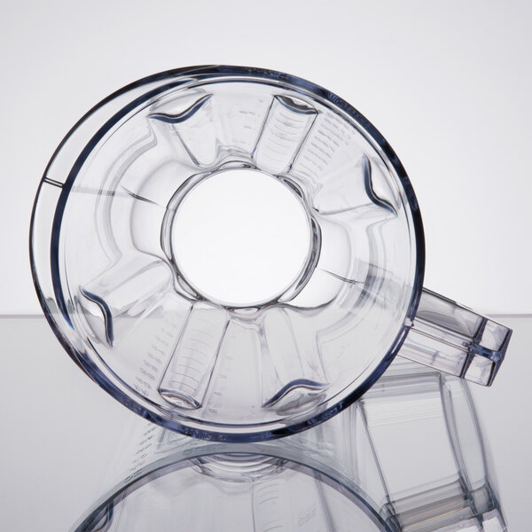 A close-up of a clear plastic Hamilton Beach blender container with a lid.