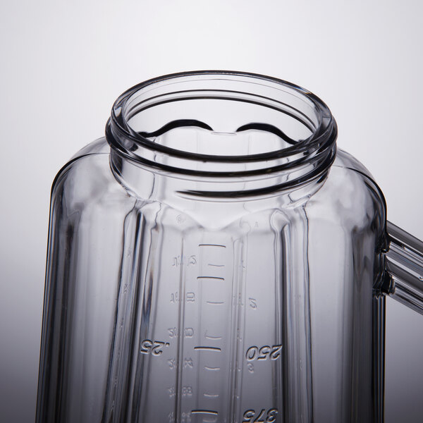 A clear plastic container with a handle for a Hamilton Beach blender.