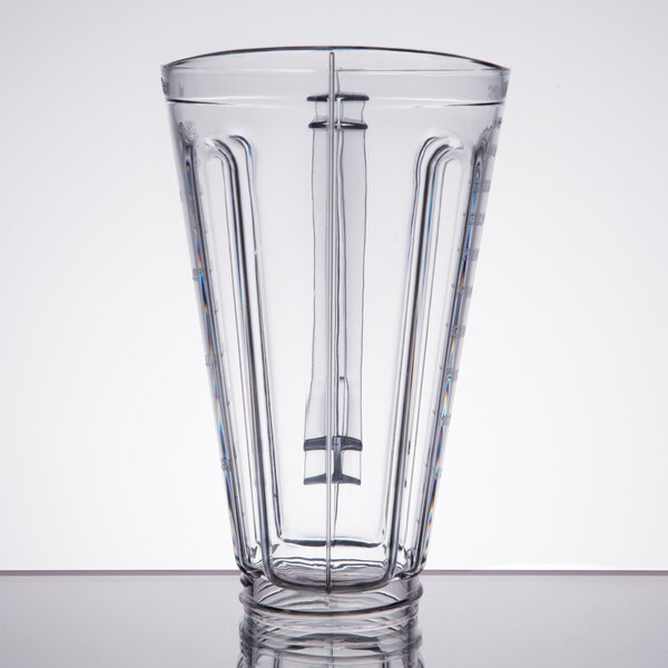 A clear plastic blender jar with a clear handle.