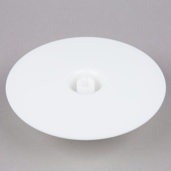 A white disc with a hole in it.