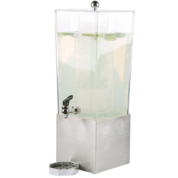 A Cal-Mil clear plastic beverage dispenser with a stainless steel base and ice chamber.