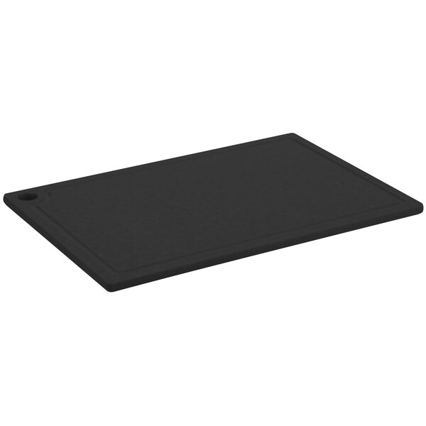 A black rectangular Cal-Mil resin cutting board with grooves and a hole in the middle.