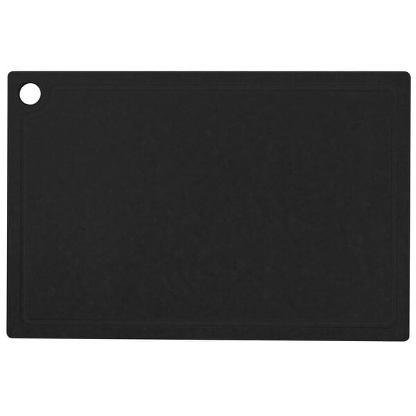 A black rectangular Cal-Mil resin cutting board with grooves.