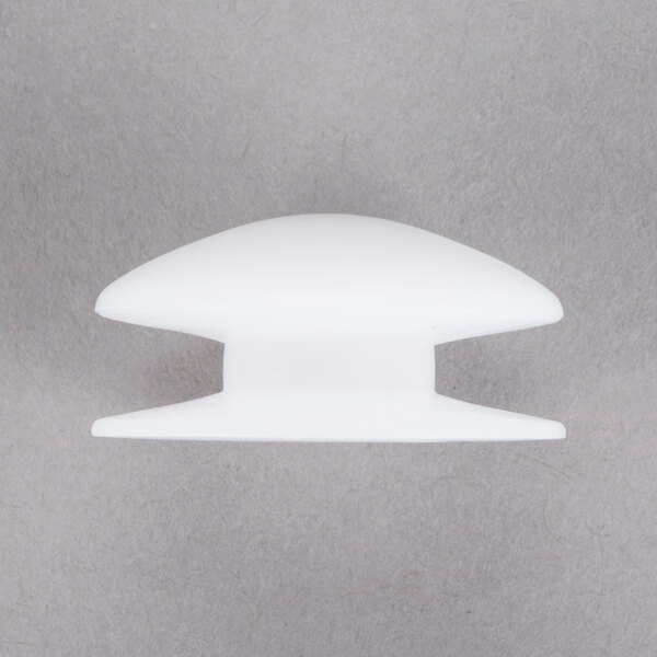 A white plastic threaded actuator knob.