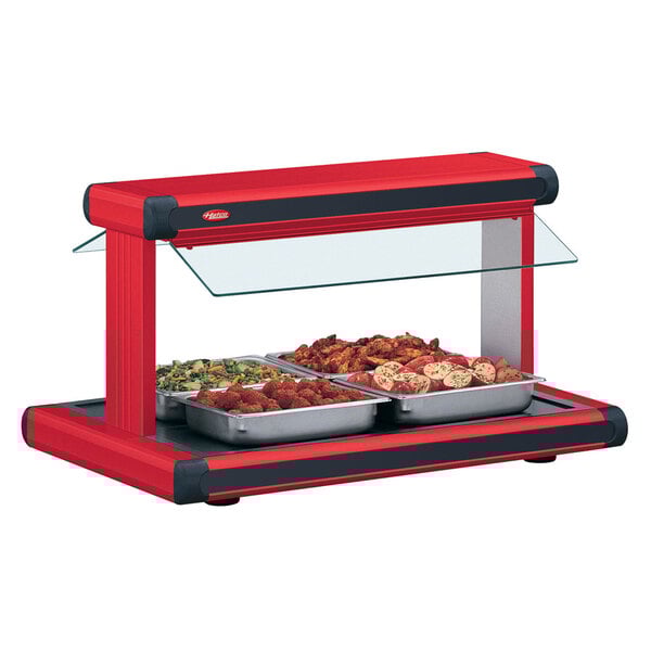 A red Hatco Glo-Ray buffet warmer with black insets on a counter.