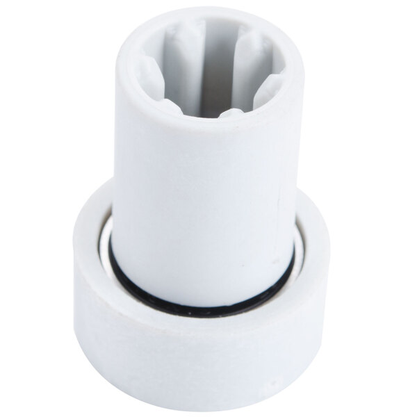 A white plastic cylinder with a black ring and metal blades inside.