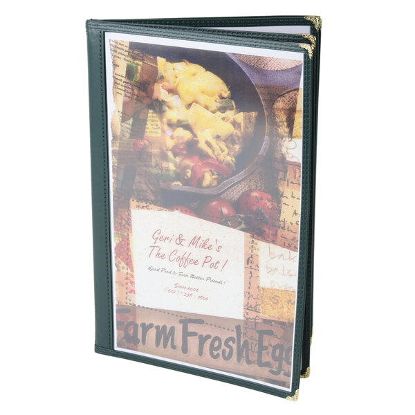 A green Menu Solutions quad panel booklet menu jacket on a restaurant counter with a menu inside.