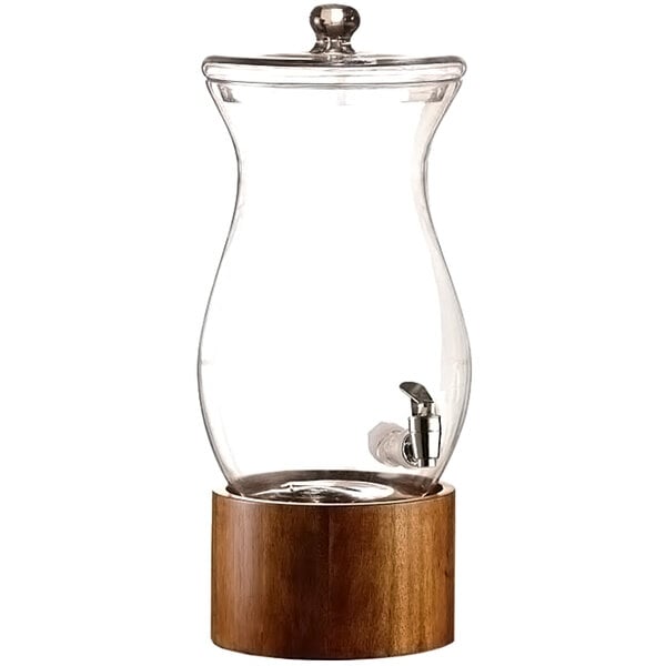 An American Atelier glass beverage dispenser with a wood base and tap.