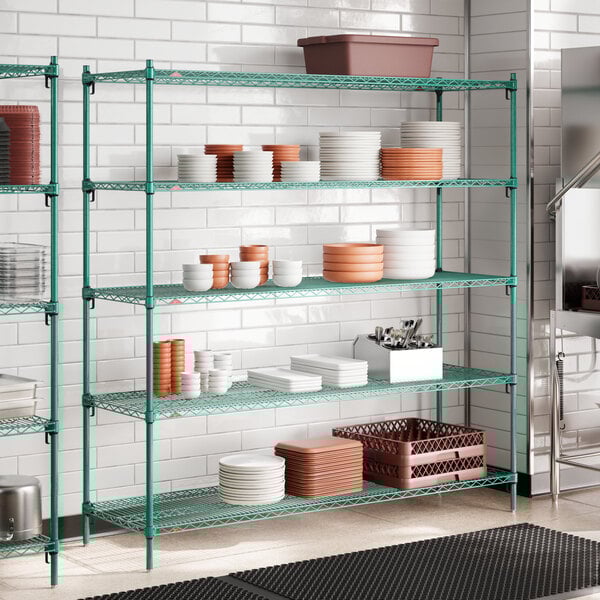 A green wire shelving unit with multiple adjustable shelves, holding various kitchenware items.