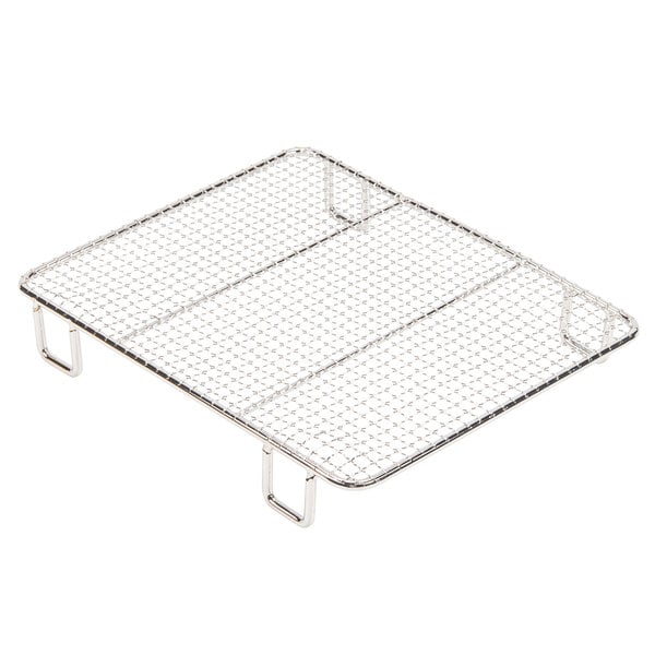 A wire mesh bottom grate for an Avantco countertop fryer.