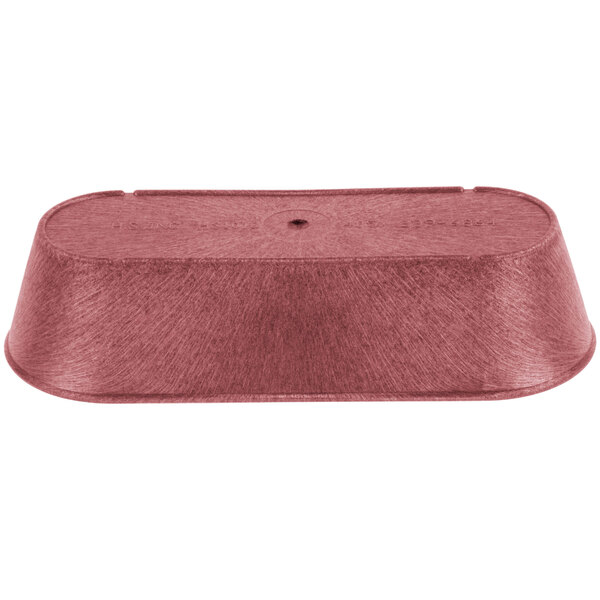 A red metal basket with a hole in it.