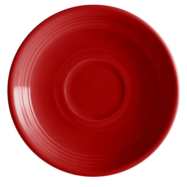 A red saucer with a rim.